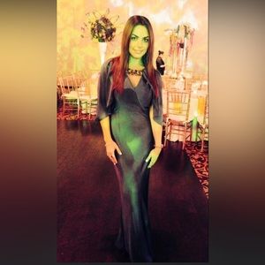 Gorgeous and luxurious Blue silk gown with keyhole front and cape sleeves.